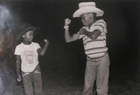 Untitled (Two children in cowboy hats, playing)