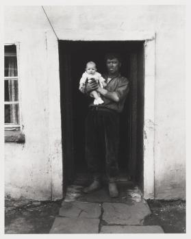 South Wales (Miner Holding Baby in Doorway)